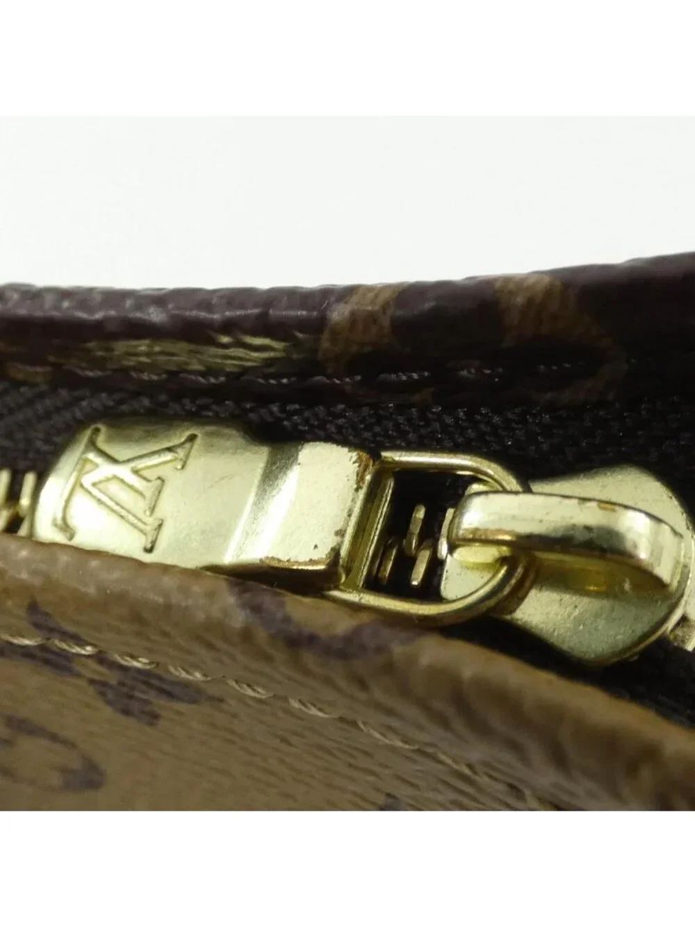 Louis Vuitton Monogram Reverse Trio Poche Toilette Pouch